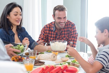 Happy family having breakfast