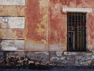Fototapeta na wymiar Old grunge wall with window close-up