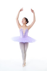 Fototapeta na wymiar Young Asian Ballerina With Braces in Dance Pose