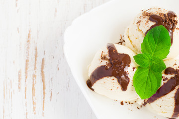  ice cream with chocolate in white bowl, copy space
