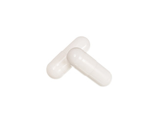 White medicine pills with drug isolated over white