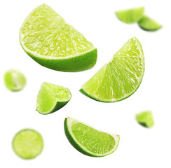 Falling limes isolated on white