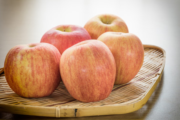 Red apple in basket