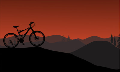 Bike silhouette in hills
