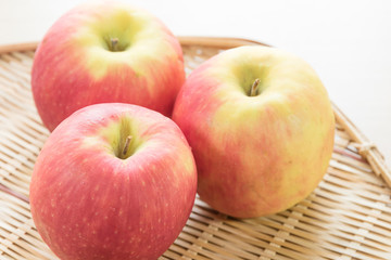 Red apple in basket