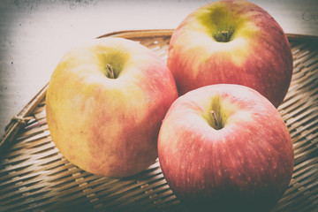 Red apple in basket