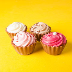Chocolate cupcakes with yellow backgroud