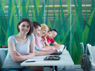 group of students study together in classroom