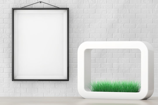Grass in White Ceramics Planter in front of Brick Wall with Blan