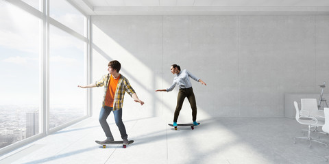 Young people ride skateboard