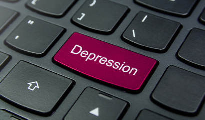 Business Concept: Close-up the Depression button on the keyboard and have Magenta color button isolate black keyboard