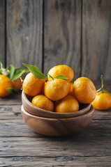 Sweet fresh tangerine on the wooden table