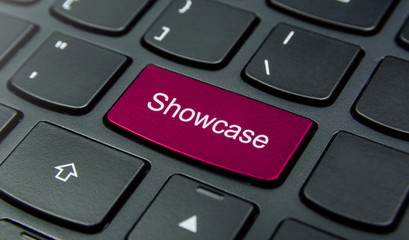 Business Concept: Close-up the Showcase button on the keyboard and have Magenta color button isolate black keyboard