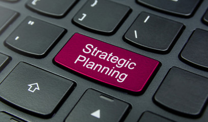 Business Concept: Close-up the Strategic Planning button on the keyboard and have Magenta color...