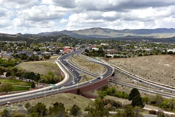  Prescott, Arizona, USA - April 25, 2016 View of highway 69 intersecting highway 89 in Prescott, Arizona with mountain and town in the background © Pamela Au