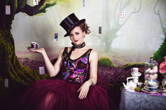 Evil Queen in bowler and a cup of tea