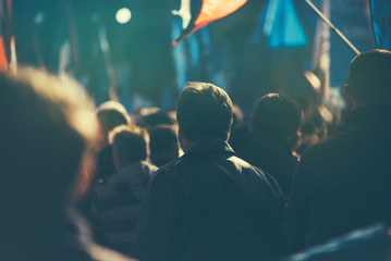 Unrecognizable people on the street during political meeting