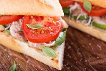 Grilled chicken sandwich with basil and tomatoes