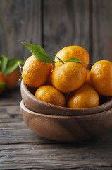 Sweet orange mandarin on the wooden table