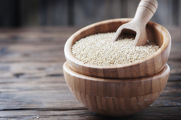 Raw quinoa on the wooden table