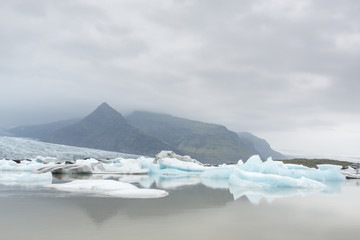 Glacial river lagoon.  Blue icebergs. Jokulsarlon glacier lake. Vatnajokull National Park. Iceland....