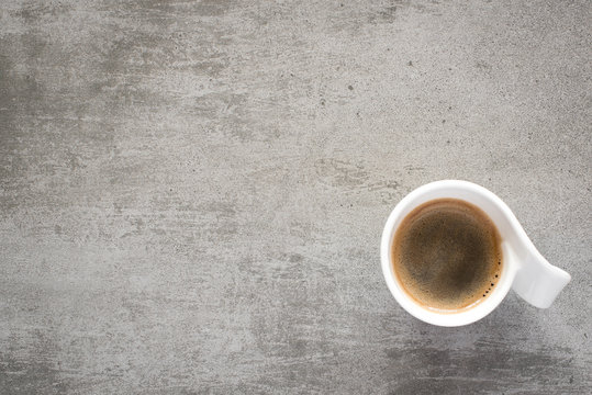 Cup of coffee on a gray concrete table