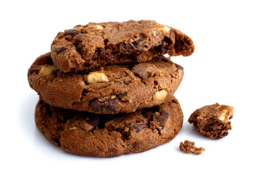 Stack of three dark chocolate chip cookies isolated. One broken - obrazy, fototapety, plakaty