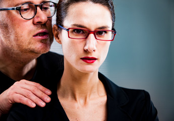 man threatens woman: harassments on the workplace