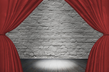 Spotlight on stage with red curtain