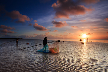 Fisher man in sunrise or sunset