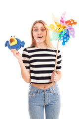 Girl play with toys and colour windmill isolated