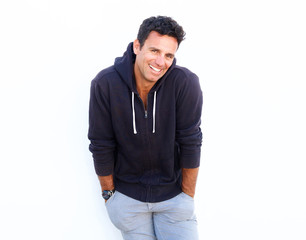 Fototapeta premium Handsome middle aged guy laughing against white background