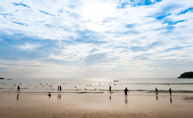 Fototapeta na wymiar People on the beach with sea and sky.