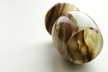 glass carved from onyx on a light background


