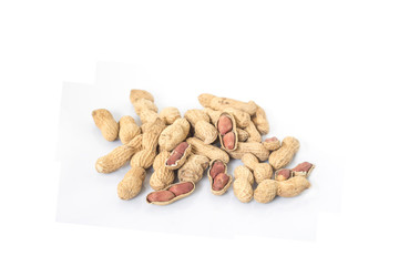 Dried peanuts in closeup on white