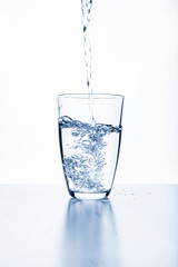 water splashing from glass isolated on white background