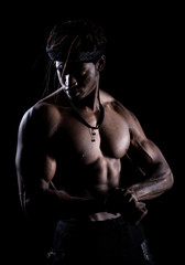 Fototapeta na wymiar Muscular man on a black background