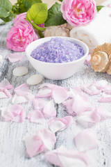 Spa salon with sea salt, towel and roses