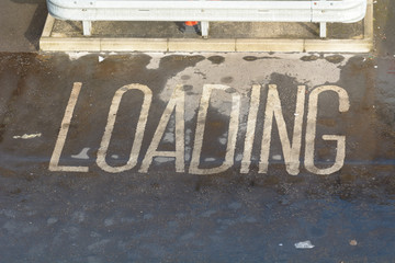 Loading sign painted on ground