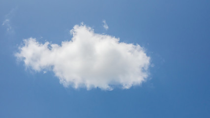 Naklejka na ściany i meble Abstract white cloud looking like a shape of fish and blue sky background