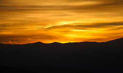 Beautiful backdrop of yellow sky at sunset over landscape