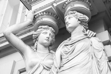 Caryatid. Statues of two young women, Vienna - obrazy, fototapety, plakaty