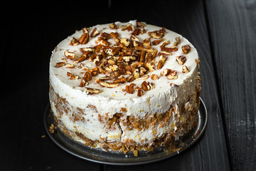 Homemade Paleo Gluten-Free Carrot Cake on Dark Wooden Background, Close-up