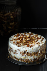 Homemade Paleo Gluten-Free Carrot Cake on Dark Wooden Background, Close-up
