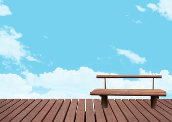 The bench on nature and cloudy sky background