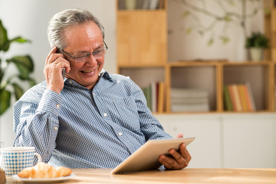 Senior man with tablet and smartphone