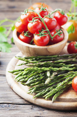 Uncooked fresh asparagus with tomato