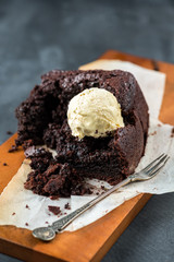 Healthy Vegan Chocolate Loaf (Cake) with Vanilla Ice-Cream Scoop on Dark Grey Background