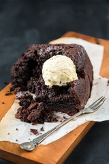 Healthy Vegan Chocolate Loaf (Cake) with Vanilla Ice-Cream Scoops on Dark Grey Background