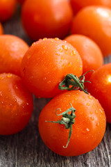 Cherry tomatoes on wooden desk